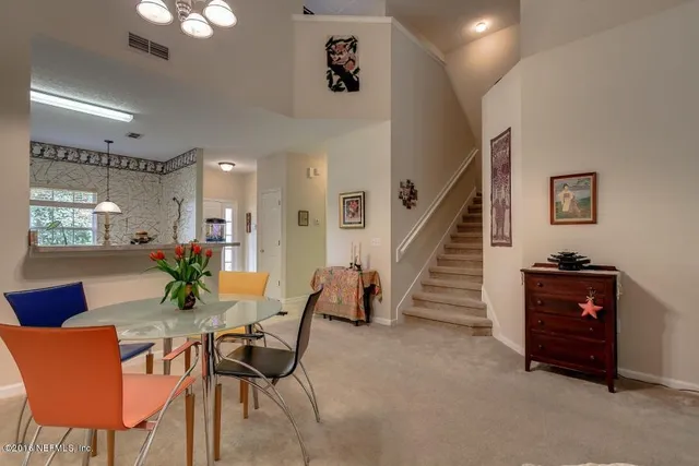 a view of a livingroom with furniture and a potted plant