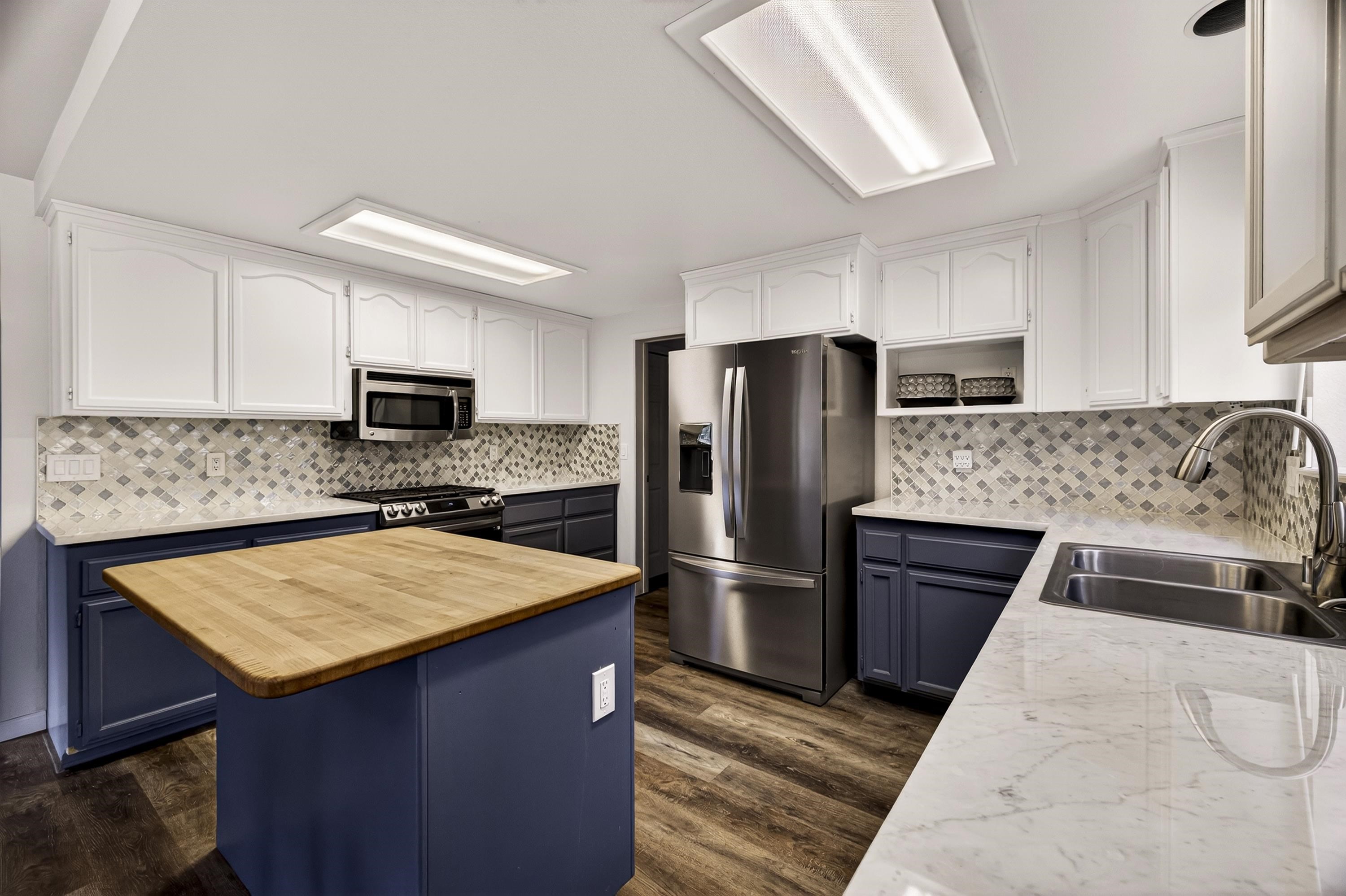 811 Golf Club Road Lake Almanor, CA 96137 - Photo 9 of 42 a kitchen with a refrigerator and a sink