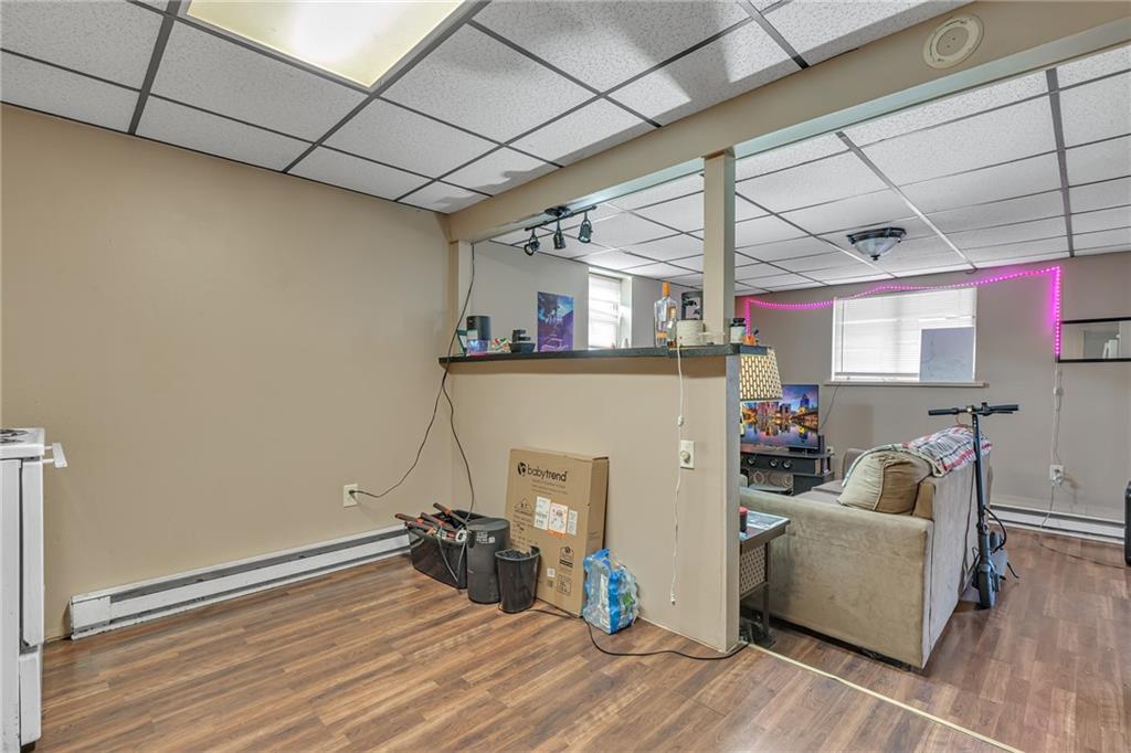565 East Madison Street Rochester, PA 15074 - Photo 11 of 13 a view of a room with wooden floor and furniture