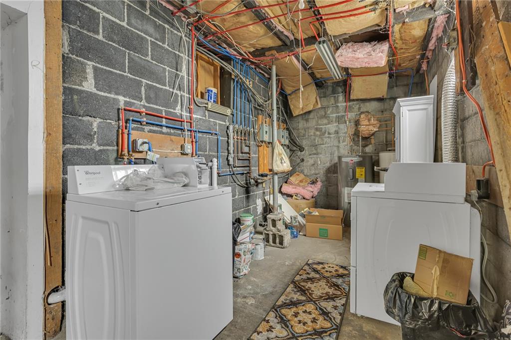 565 East Madison Street Rochester, PA 15074 - Photo 13 of 13 a utility room with dryer and washer