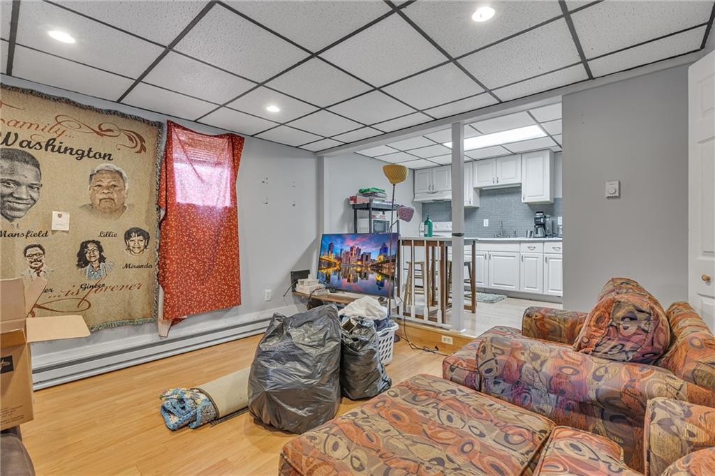 565 East Madison Street Rochester, PA 15074 - Photo 4 of 13 a living room with lots of furniture and a chandelier