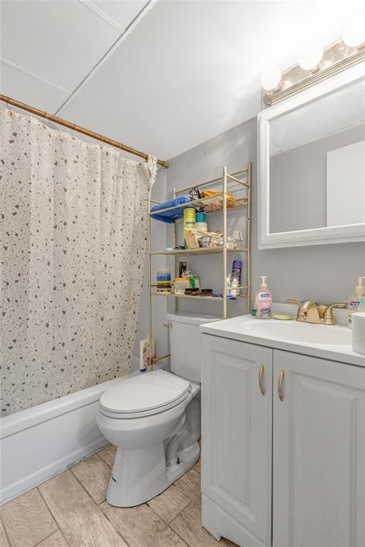 565 East Madison Street Rochester, PA 15074 - Photo 6 of 13 a bathroom with a toilet sink vanity and mirror