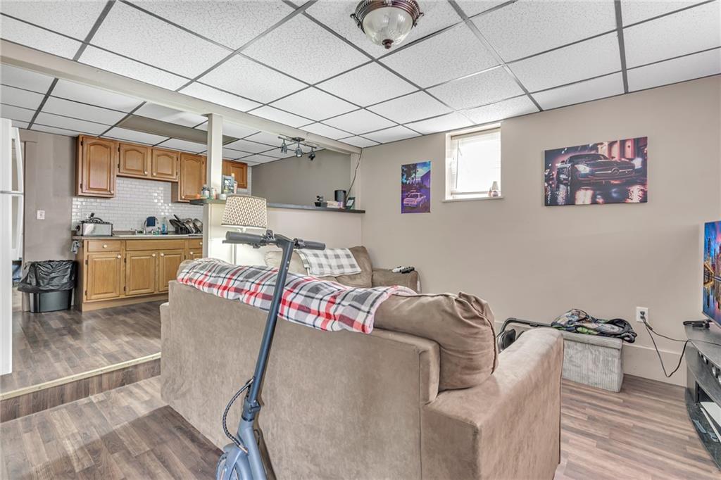 565 East Madison Street Rochester, PA 15074 - Photo 7 of 13 a living room with furniture and a table