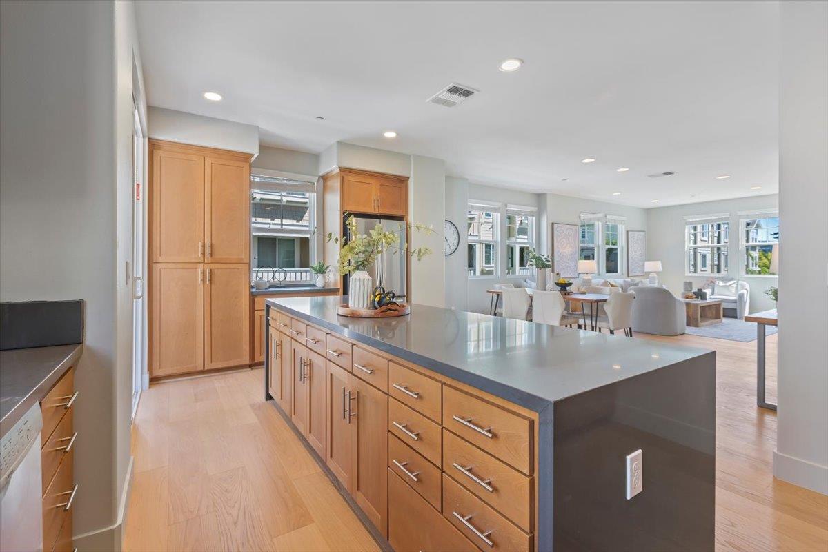 850 Sycamore Loop Mountain View, CA 94043 - Photo 16 of 36 a kitchen with stainless steel appliances granite countertop a sink a stove and a refrigerator