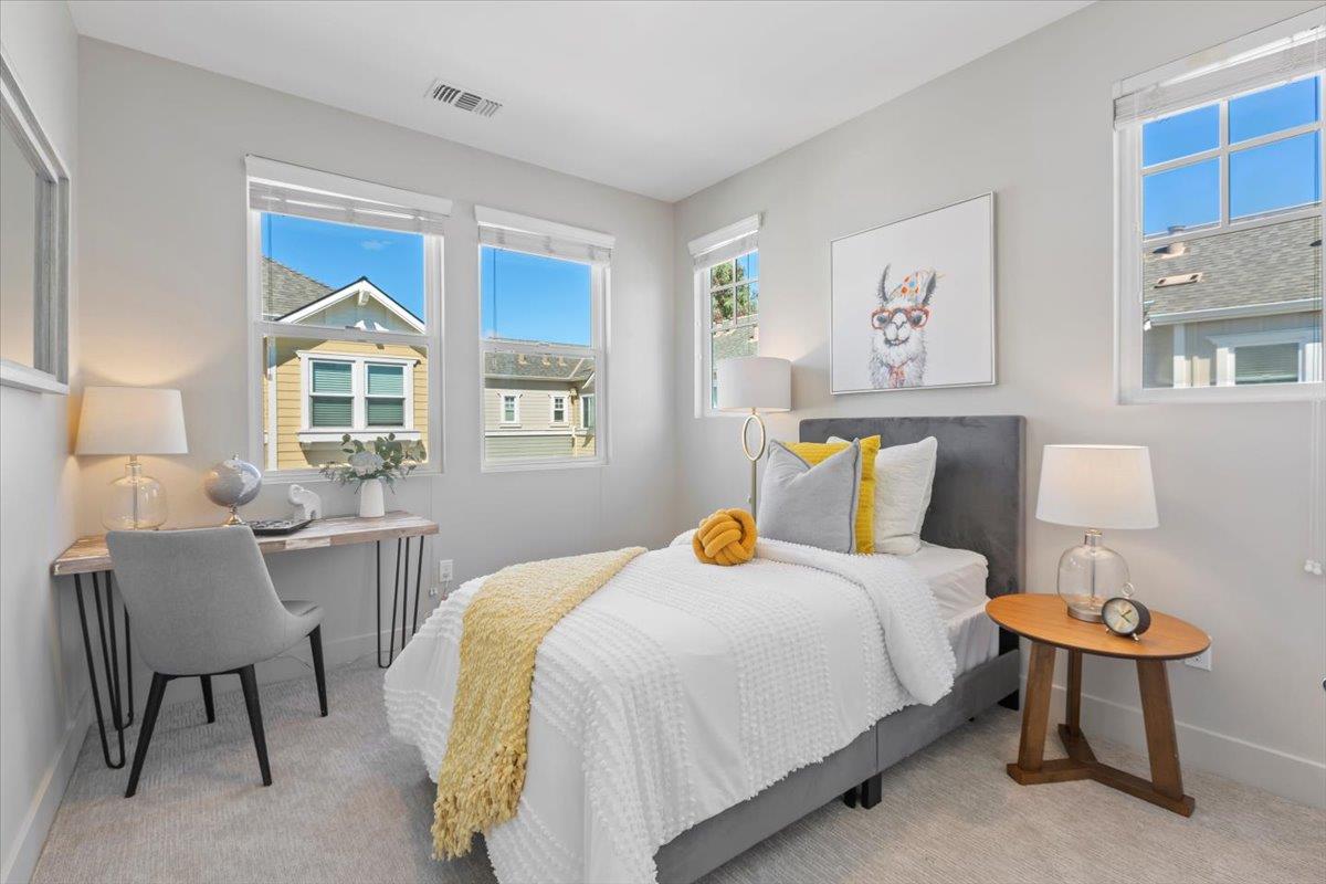 850 Sycamore Loop Mountain View, CA 94043 - Photo 22 of 36 a bedroom with a bed and a table in it