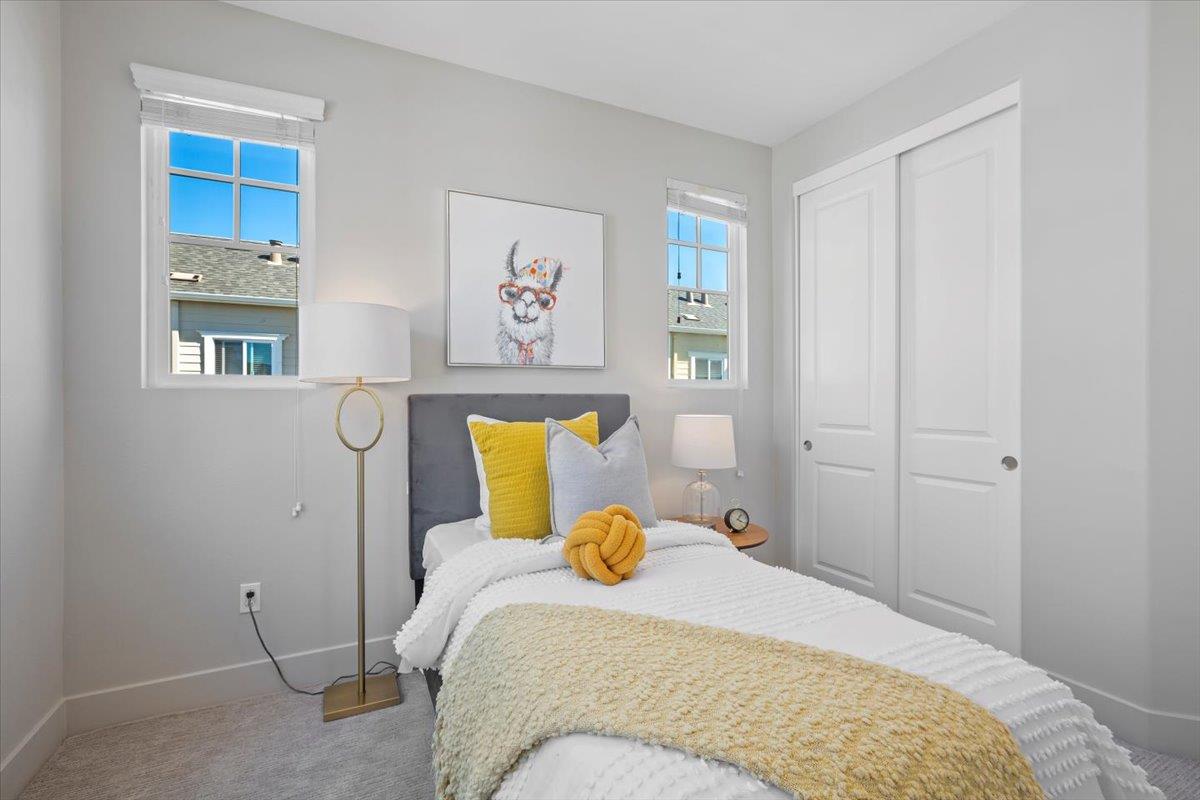 850 Sycamore Loop Mountain View, CA 94043 - Photo 23 of 36 a bedroom with a bed and wooden floor