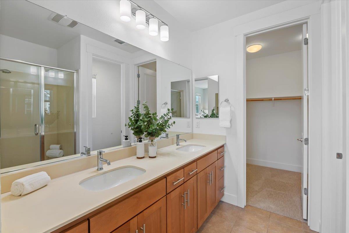 850 Sycamore Loop Mountain View, CA 94043 - Photo 28 of 36 a bathroom with a granite countertop sink and a mirror