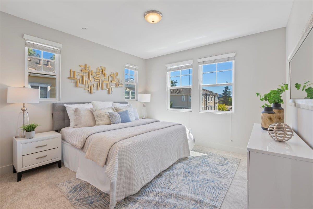 850 Sycamore Loop Mountain View, CA 94043 - Photo 30 of 36 a bedroom with a bed a couch and a window