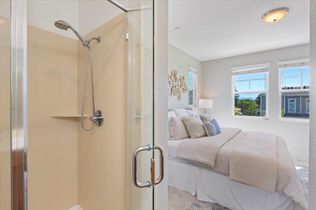 850 Sycamore Loop Mountain View, CA 94043 - Photo 31 of 36 a bedroom with a bed and a chandelier