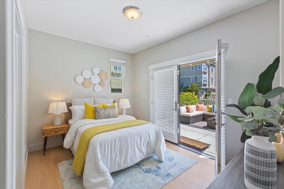 850 Sycamore Loop Mountain View, CA 94043 - Photo 34 of 36 a bedroom with a bed and a couch