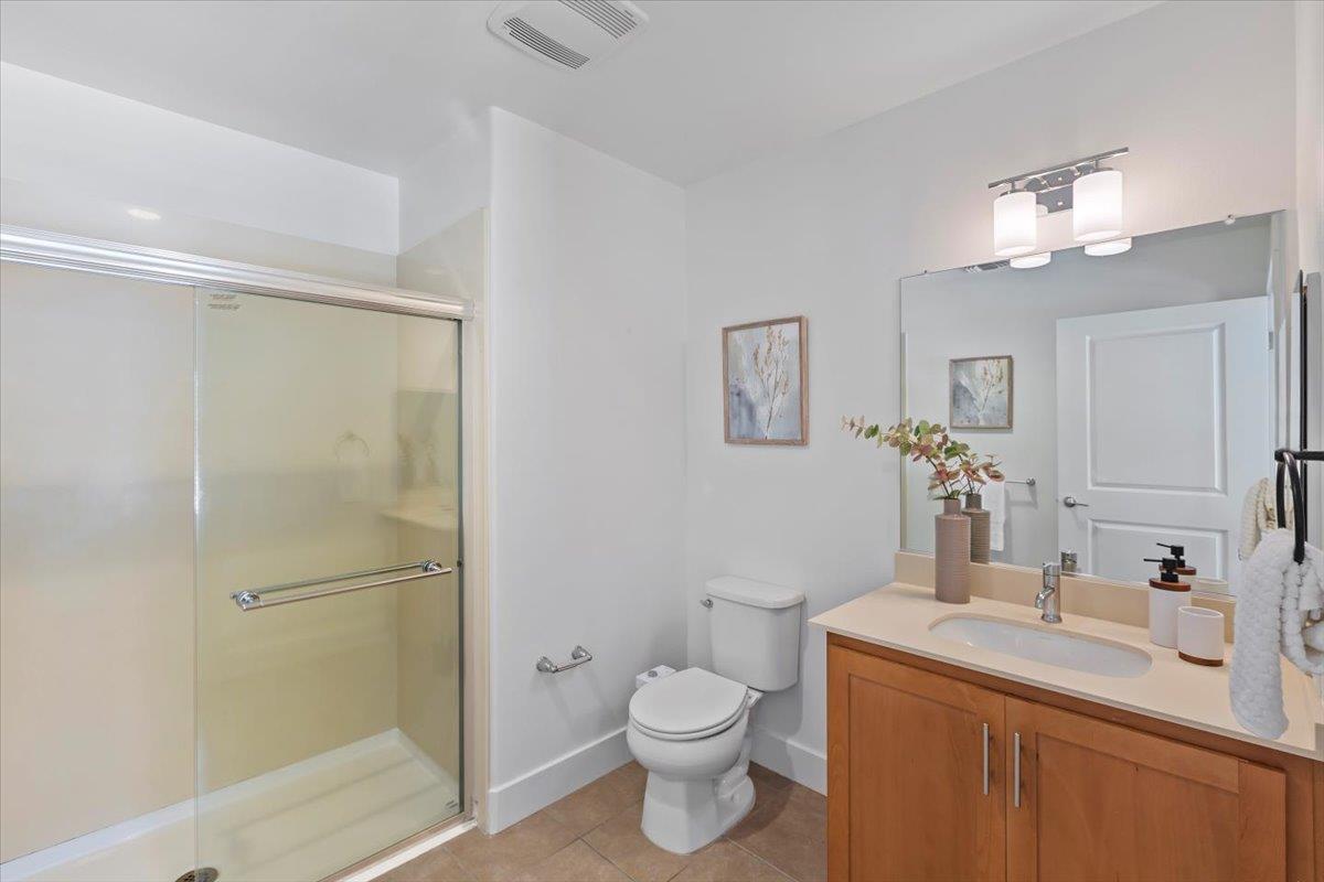 850 Sycamore Loop Mountain View, CA 94043 - Photo 36 of 36 a bathroom with a granite countertop sink toilet and shower