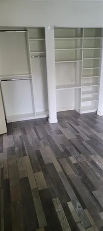 a view of an empty walk in closet