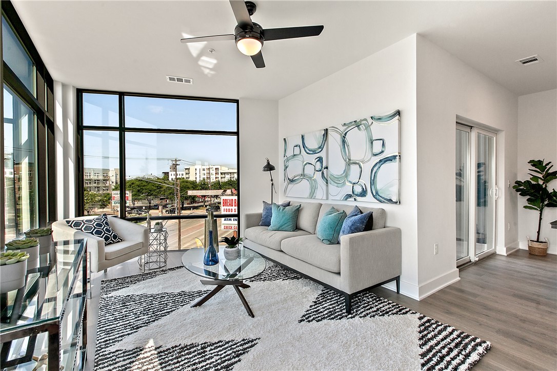 2220 Webberville Road, Unit 305 Austin, TX 78702 - Photo 1 of 1 a living room with furniture and a large window