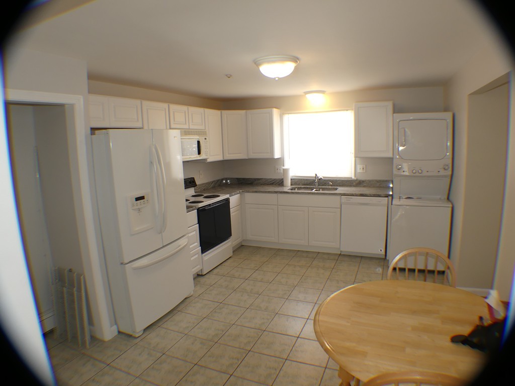 20 Lawrence Road, Unit 3 Rowley, MA 01969 - Photo 10 of 25 a kitchen with white cabinets and white appliances