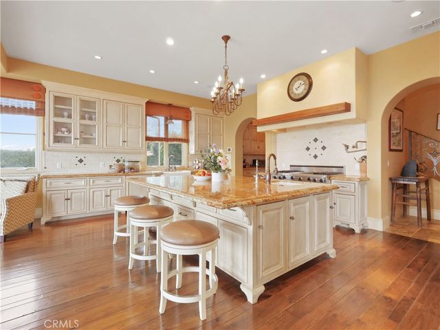 a living room with fireplace furniture and a flat screen tv