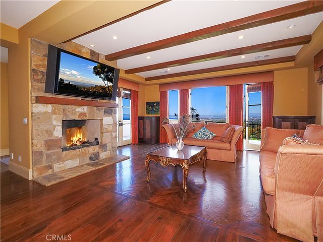 a bathroom with a granite countertop sink a mirror and a bathtub