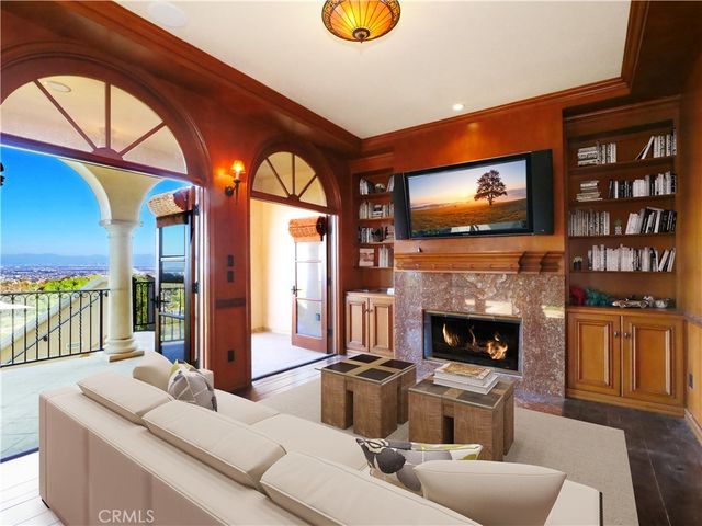 a kitchen with stainless steel appliances granite countertop a sink a stove a counter top space and cabinets