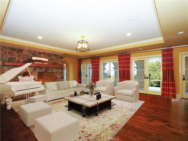 a spacious bathroom with a granite countertop sink a mirror and shower