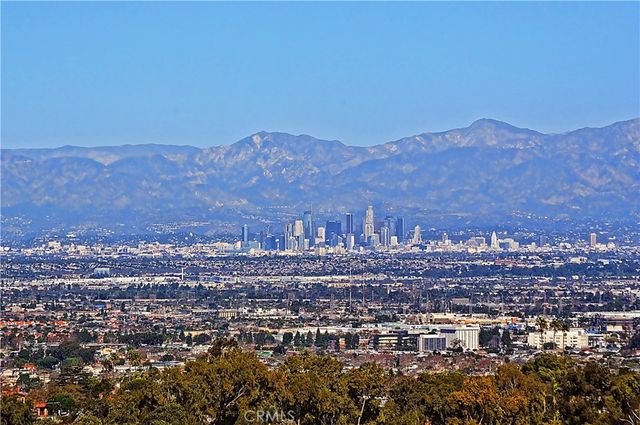 a view of an ocean with a mountain