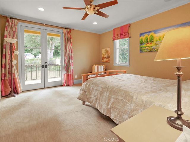 a bathroom with a granite countertop sink a mirror and shower