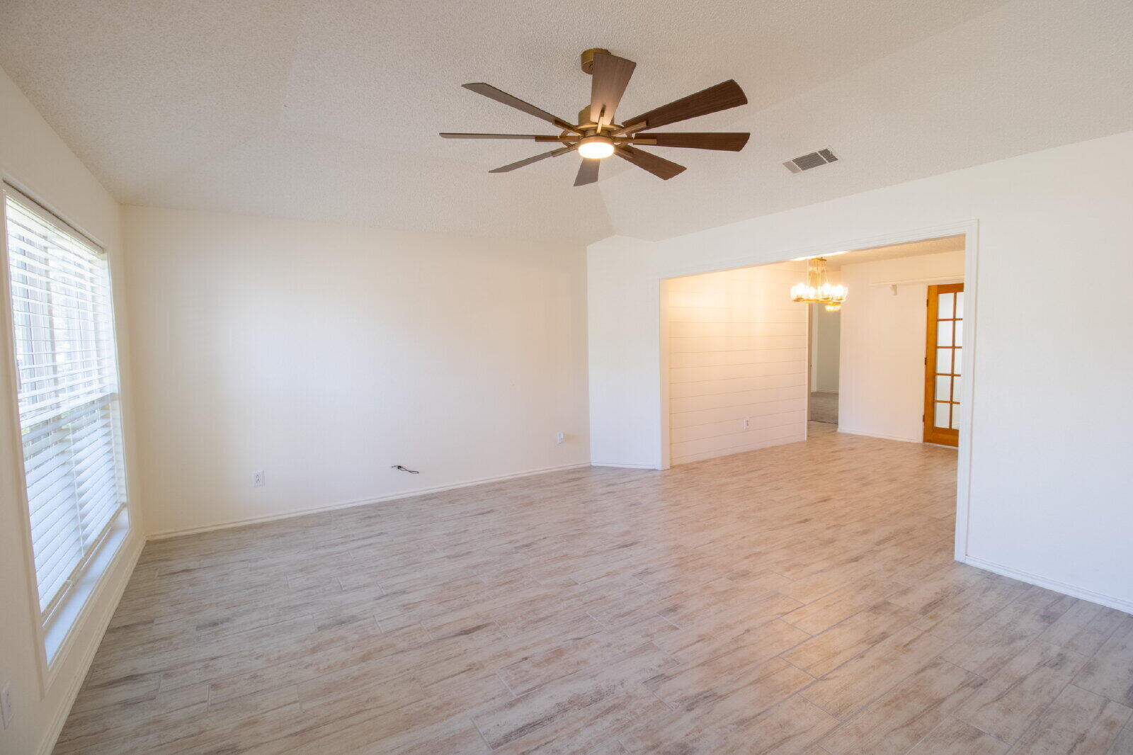 5731 95th Street Lubbock, TX 79424 - Photo 17 of 30 a view of an empty room with a window