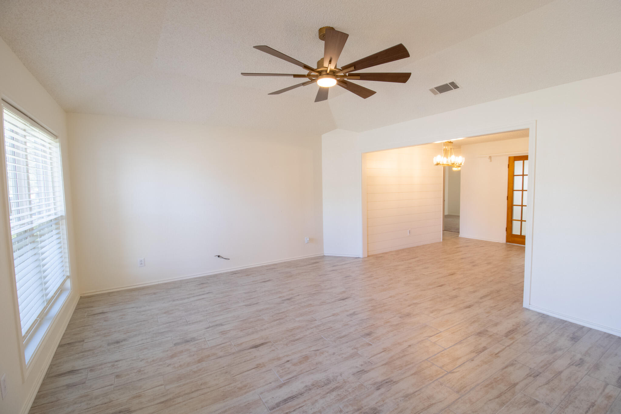 5731 95th Street Lubbock, TX 79424 - Photo 2 of 30 a view of an empty room with a window