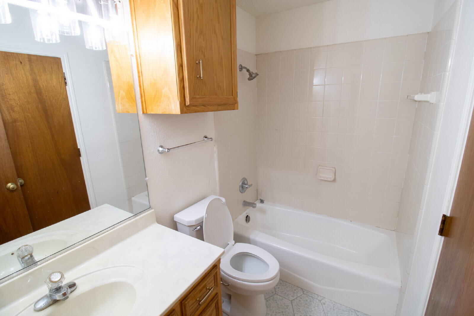5731 95th Street Lubbock, TX 79424 - Photo 25 of 30 a bathroom with a sink and a mirror