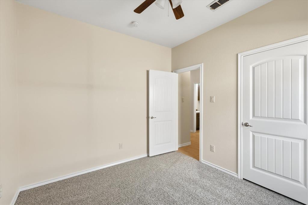 720 Rio Bravo Drive Fort Worth, TX 76052 - Photo 29 of 38 Neutral wall finishes with crisp white trim