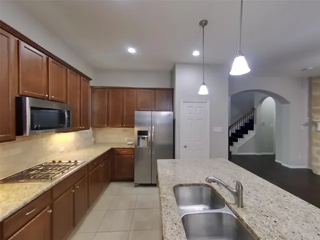 a brick building with a yard