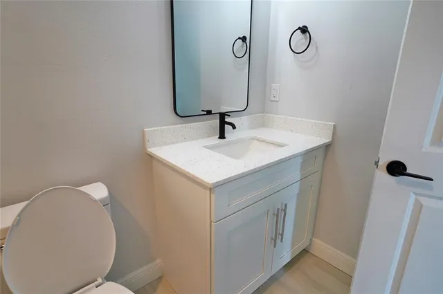a bathroom with a sink and mirror