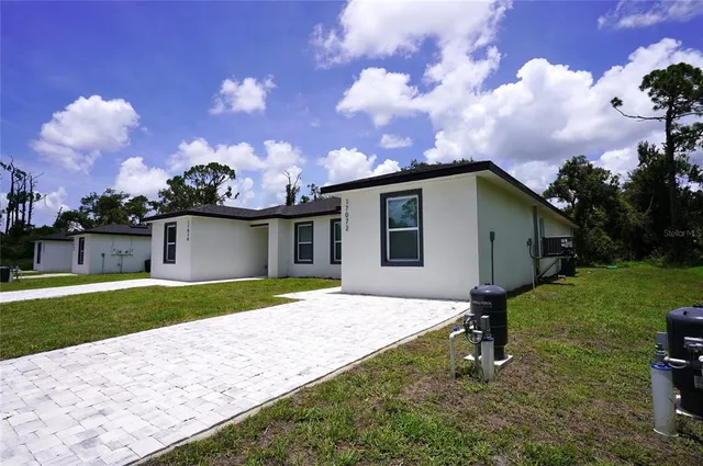 a house view with a backyard space