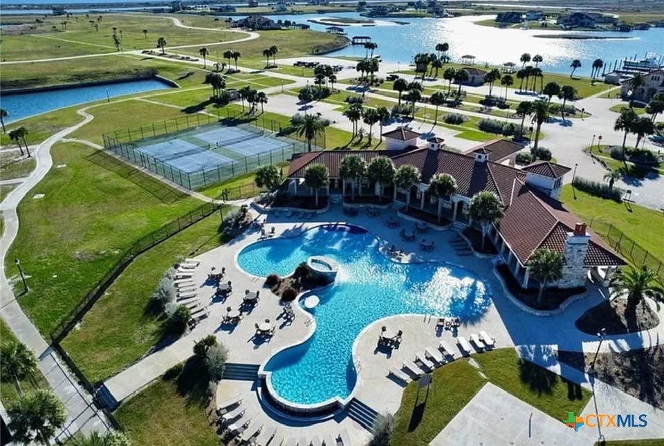 72 Blanc Court Port O'Connor, TX 77982 - Photo 6 of 8 a view of a swimming pool with outdoor seating