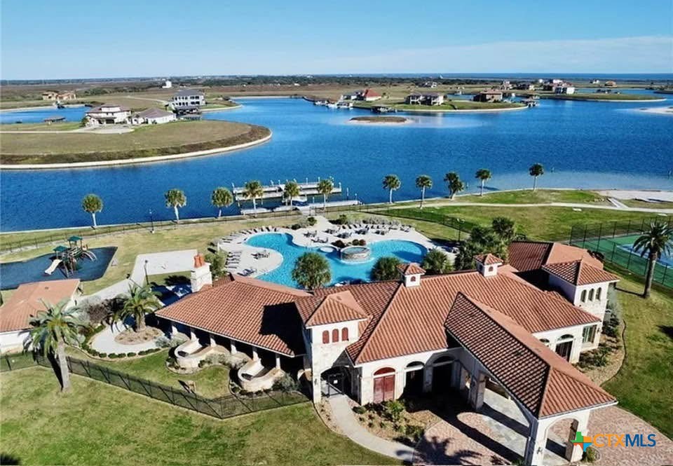 72 Blanc Court Port O'Connor, TX 77982 - Photo 7 of 8 an aerial view of residential houses with outdoor space