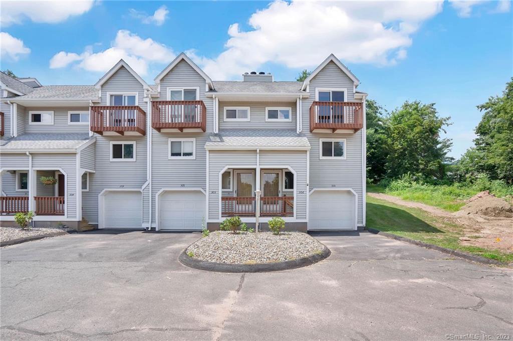 70 Old Town Road, Unit 306 Vernon, CT 06066 - Photo 1 of 1 a front view of a house with a yard and garage