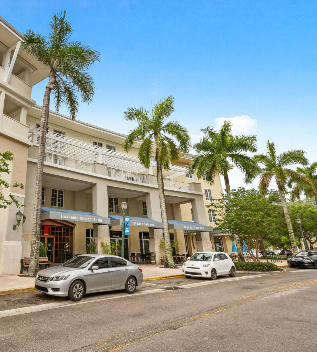 a city street lined with buildings and cars