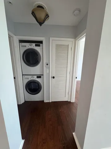 a view of a hallway with washer and dryer