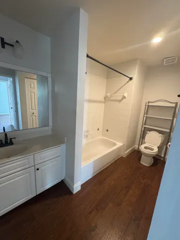 a bathroom with a bathtub and a shower