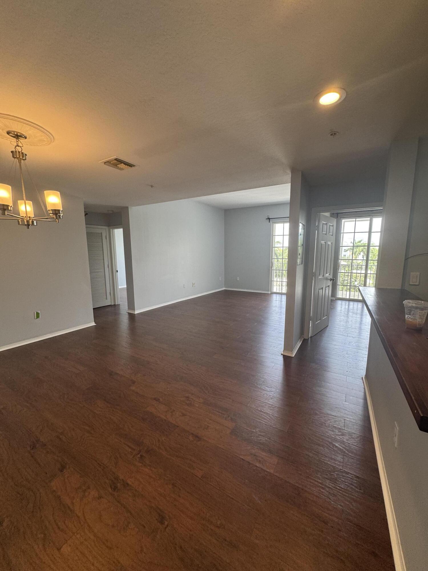 1200 Town Center Drive, Unit 426 Jupiter, FL 33458 - Photo 8 of 11 a view of hallway with wooden floor