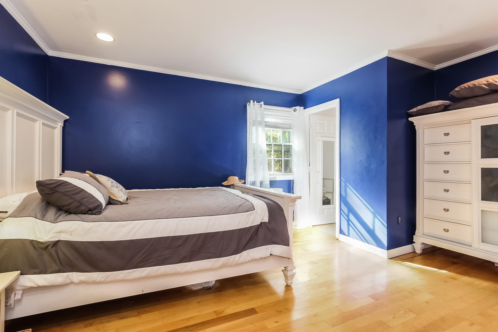 390 Jones Road Marstons Mills, MA 02648 - Photo 14 of 41 a bedroom with a bed and a dresser