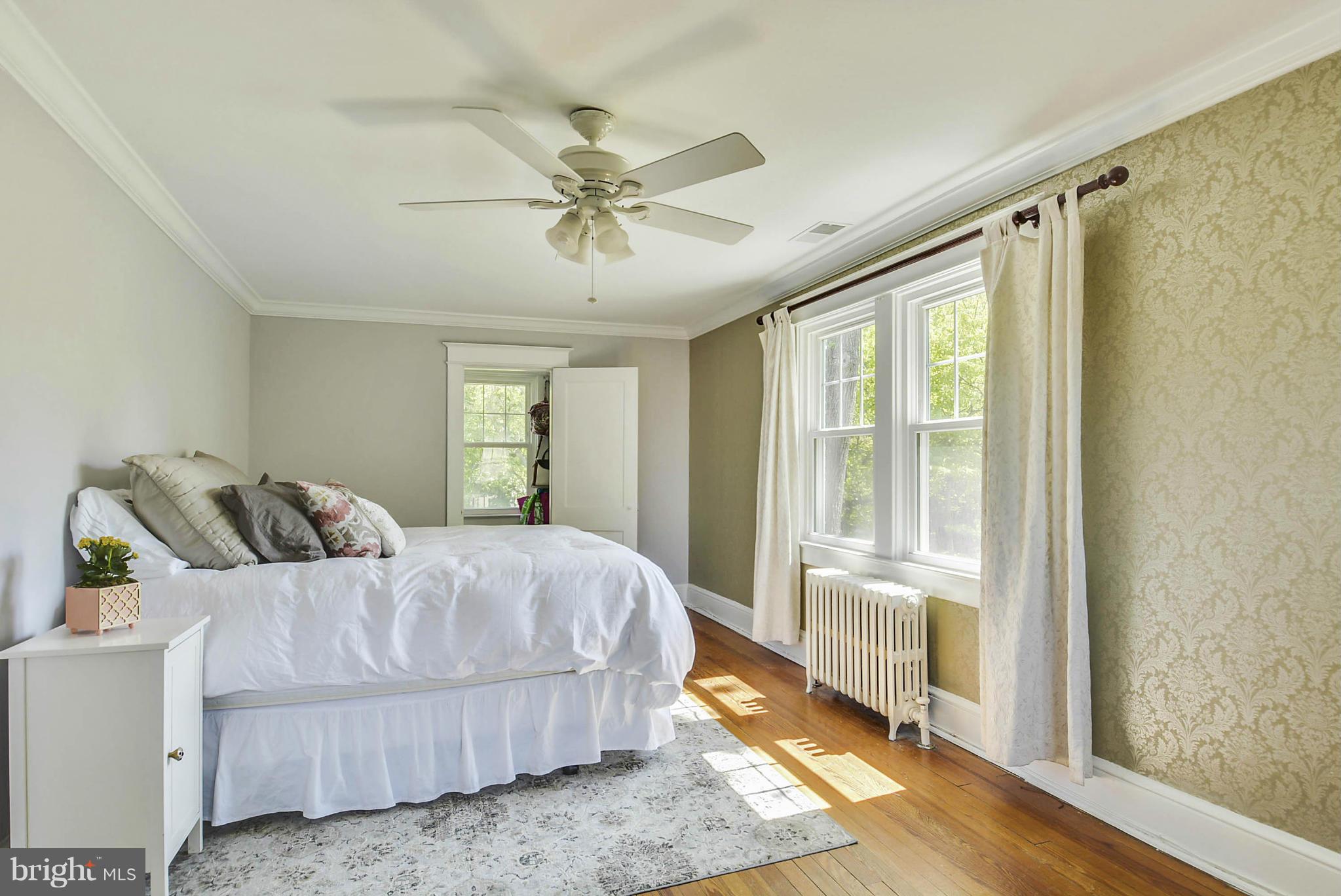 9511 Colesville Road Silver Spring, MD 20901 - Photo 22 of 30 Features crown molding and hardwood floors.