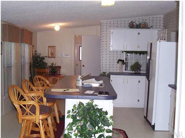 5158 Bent Tree Road Milton, FL 32583 - Photo 5 of 9 Center island and breakfast nook in kitchen.