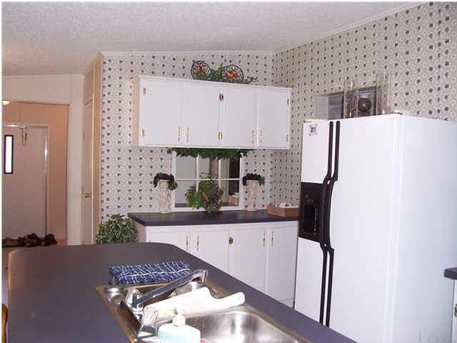 5158 Bent Tree Road Milton, FL 32583 - Photo 6 of 9 Plenty of cupboards in kitchen.