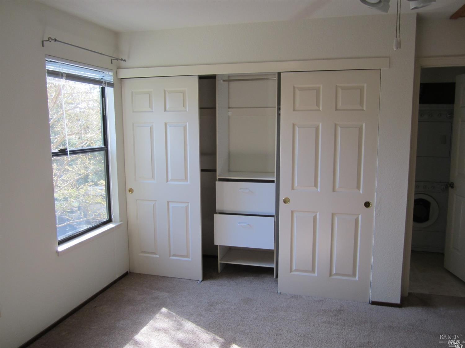 1939 Windmill Circle Santa Rosa, CA 95403 - Photo 12 of 20 an empty room with windows and closet