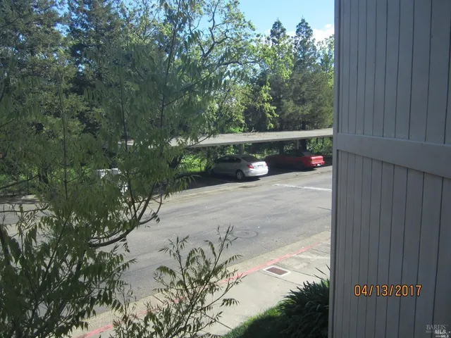 a view of a wooden fence next to a yard