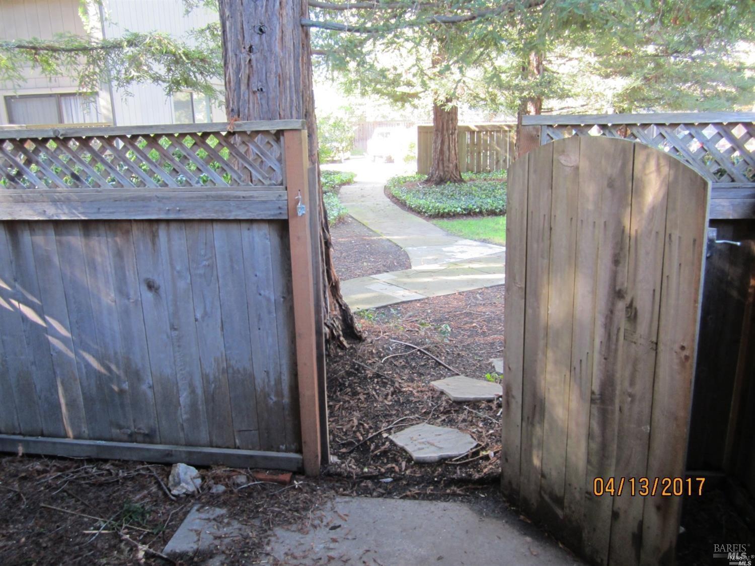 1939 Windmill Circle Santa Rosa, CA 95403 - Photo 18 of 20 a view of a wooden fence next to a yard
