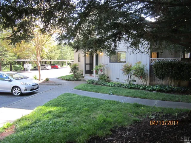 a view of a car parked in front of a house
