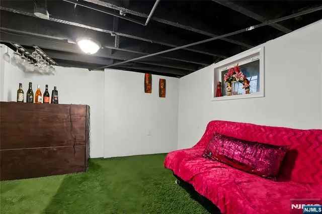 a utility room with dryer and table