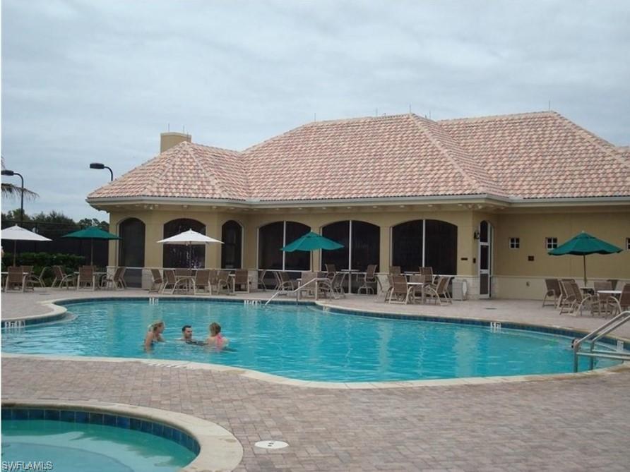 13060 Amberley Court, Unit 807 Bonita Springs, FL 34135 - Photo 29 of 33 a front view of house with yard and outdoor seating