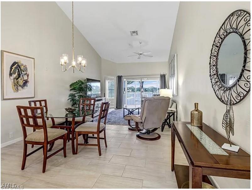 13060 Amberley Court, Unit 807 Bonita Springs, FL 34135 - Photo 7 of 33 a view of a dining room with furniture and a chandelier