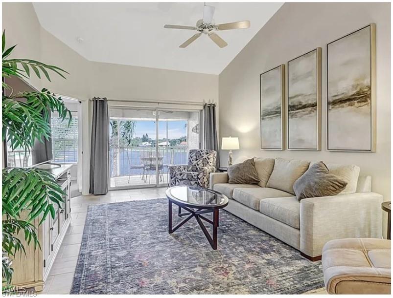 13060 Amberley Court, Unit 807 Bonita Springs, FL 34135 - Photo 9 of 33 a living room with furniture and a large window